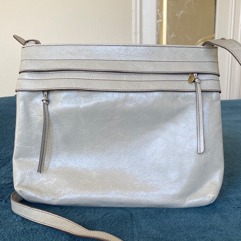 Hobo Larkin crossbody bag in a gray distressed leather